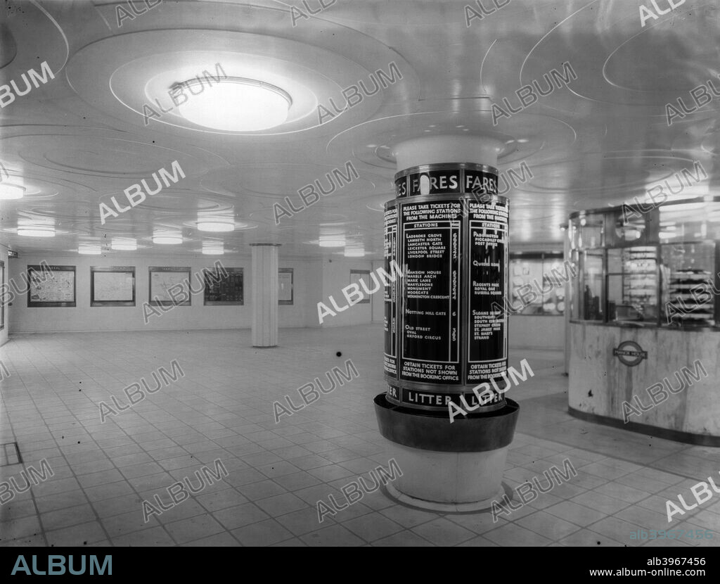 Manor House Underground Station, Stoke Newington, London, 1932. The ticket hall of Manor House Underground Station, Stoke Newington, is seldom empty.  The notice board around the central pillar displays the fares (in pre-decimal currency) to other stations. Manor House is on the Piccadilly line.