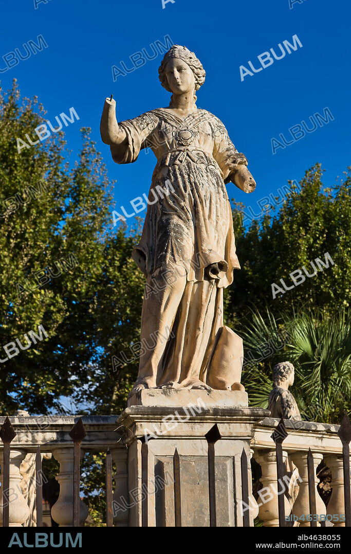 Palermo, the Parliament Square: The Marble Theatre, monument to Philip V, facing The royal Palace or Palace of the Normans. It was realised by Gaspare Guercio, Carlo D'Aprile and Gaspare Serpotta to celebrate the glory of Philip IV of Habsburg, king of Spain and Sicily, called Philip the Great.. Around the pedestal the four parts of the Earth known at that time (Europe, Asia, Africa and America), on which the king of Spain ruled, are depicted. On the first level there are the statues of the four Moors, or the previous kings of the countries that went under his domination. The work is adorned with plaques and coats of arms of the most important families in Sicily. The original statue of Philip IV was destroyed during the Sicilian revolution in 1848 and was replaced in 1856 by the current marble statue representing King Philip V of Spain and was realised by Nunzio Morello.. Detail.