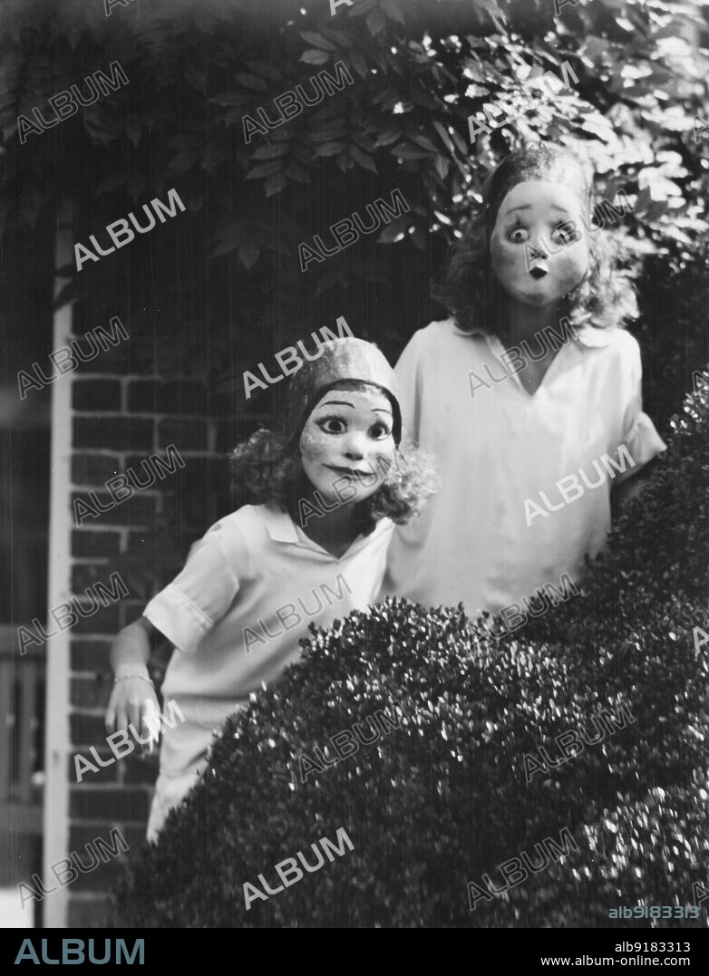 ARNOLD GENTHE. People wearing masks made by W.T. Benda, 1925 Sept. 20.