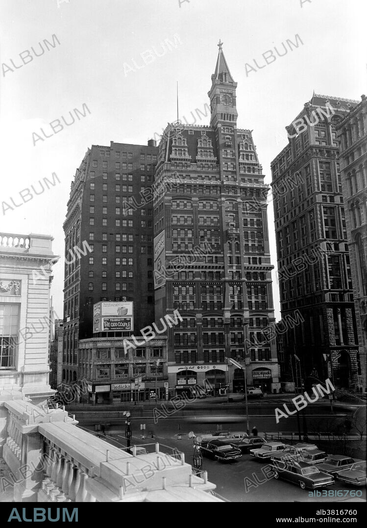 The New York Tribune Building was a building built by Richard Morris Hunt in 1875. It was built as the headquarters of the New York Tribune, and was a brick and masonry structure topped by a Clock Tower. The Tribune was located at 154 Printing House Square on Nassau and Spruce streets, stood 260 feet tall and was one of the first high-rise elevator buildings. Originally a 9 story building, between 1903 and 1905, nine more floors were added by the architects D'Oench & Yost and L. Thouyard to make it an 18 story building. The building has been put forward as a possible candidate as the first ever skyscraper. Pace University held its first classrooms in the building, renting out one room in 1906. The building was demolished in 1966 to make room for the 1 Pace Plaza building. Historic American Buildings Survey, John Feulner, Photographer March 1966.