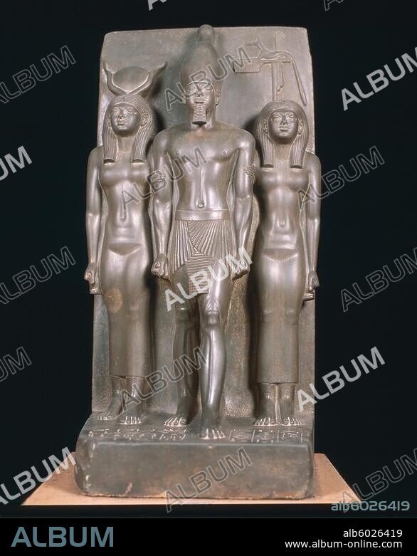 Menkaure, Egyptian Pharaoh of the 4th dynasty, c.2520 BC.-Triad of Menkaure.-Pharaoh Menkaure between goddess Hathor (left) and the personification of the Egypt.nome (district) Fal Hu (Dispolis Parva). Sculpture, greywacke, height 92.5cm. Found: Giza, Valley Temple of Menkaure.