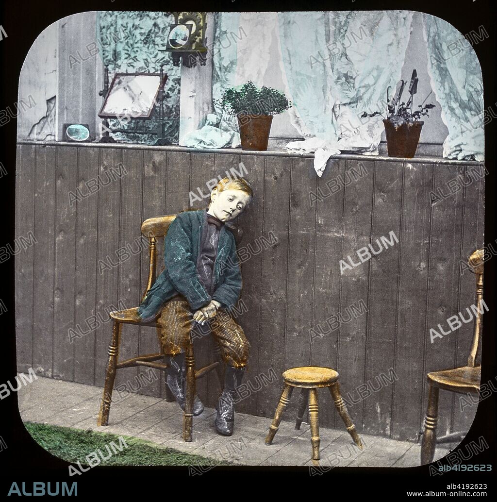 Magic lantern slide circa 1900.Victorian/Edwardian.Social History. Mrs Isabel Reaney story of Willie Wills Wings and slide show a christian story . Life model painted background. SLide 15 'Are you feeling quite well to-day Willie?' poor boy on stool looking unwell.
