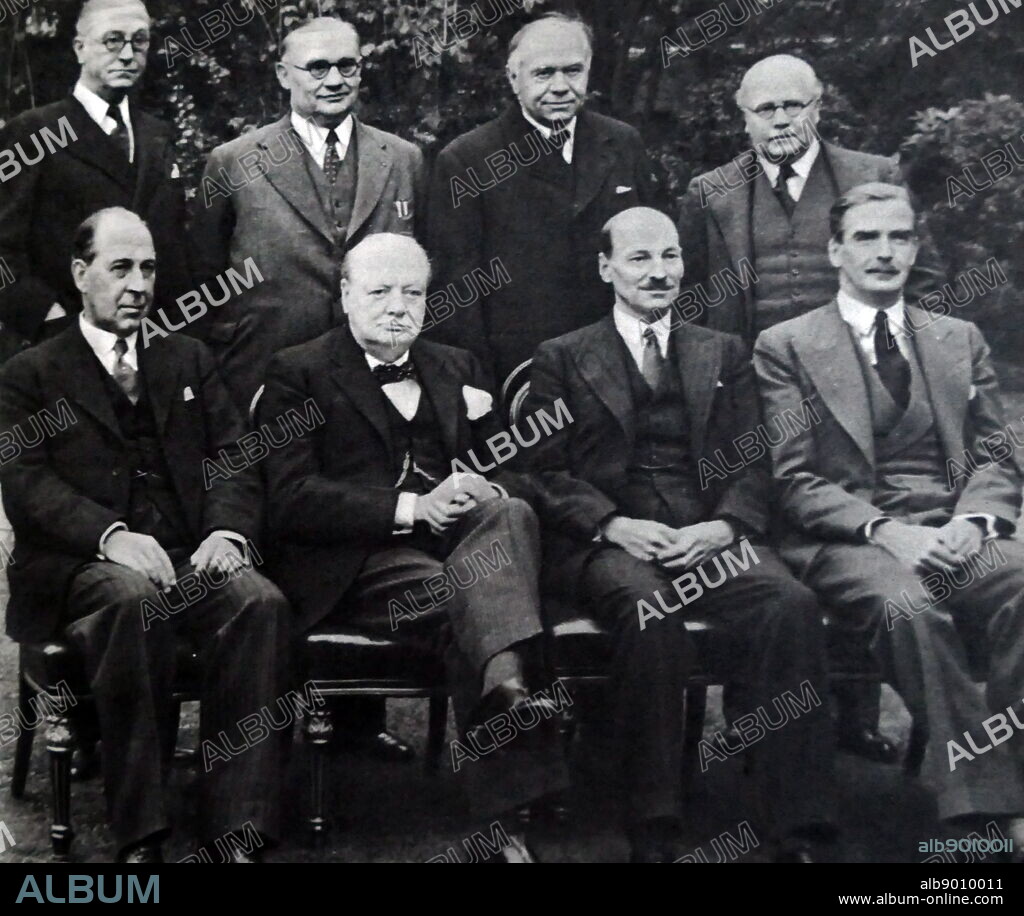 Photograph of Sir Winston Churchill sitting alongside other members of his War Cabinet. (Back row: left to right) Mr Arthur Greenwood (1880-1954) Deputy Leader of the Labour Party; Mr Ernest Bevin (1881-1951) Minister of Labour; Max Aitken, 1st Baron Beaverbrook (1879-1964) Minister of Aircraft Production; Sir Kingsley Wood (1881-1943) Chancellor of the Exchequer. (Front row: left to right) John Anderson, 1st Viscount Waverley (1882-1958) Lord President of the Council; Sir Winston Churchill (1874-1965) Prime Minister of the United Kingdom; Clement Attlee (1883-1967) Lord Privy Seal; Anthony Eden (1897-1977) Foreign Secretary. Dated 20th Century.