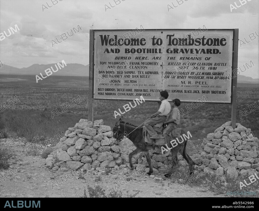 DOROTHEA LANGE. Sign entering Tombstone, Arizona. ['Welcome to Tombstone and Boothill Graveyard. Buried here are the remains of Tom McLowery - Frank McLowery and Billie Clanton} killed in Earp-Clanton Battle Sept. 26th 1881; Dan Dowd. Red Sample. Tex Howard. Billl DeLaney and Dan Kelly} hanged legally by J.E. Ward, Sheriff, for the Bisbee Massacre, Mar. 8th 1884; John Heath, lynched by Bisbee Mob, Feb 22nd 1884; M. R. Peel, murdered in Charleston, March 8th 1882; Billy Grounds. "Dutch" Annie. Indian Bill. Pat Lynch. Billy Kinsman. Black Jack. Brady Brothers. Mike Noonan. China Mary. John Hicks.'].