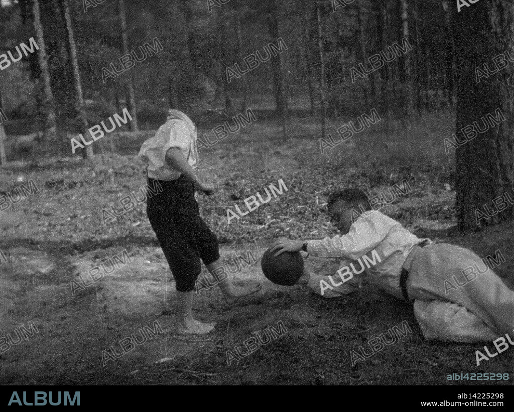 NINA VASILYEVNA VARZAR SHOSTAKOVICH. Dmitri Shostakovich plays football with his son Maxim in Komarovo.