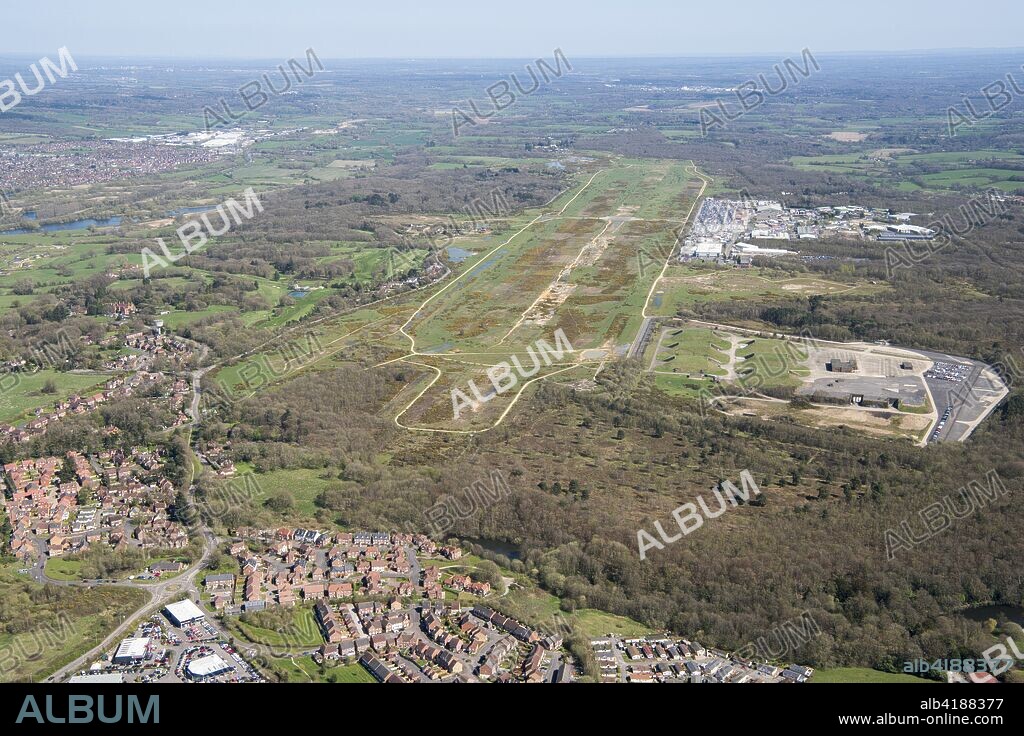 Former Greenham Common Airbase, Newbury, West Berkshire, 2018. Aerial view from the south-west. Opened in 1942, the airfield was used by the RAF and USAAF during the Second World War. Greenham Common became famous during the 1980s due to presence of peace demonstrators protesting at the siting of American nuclear cruise missiles at the base.