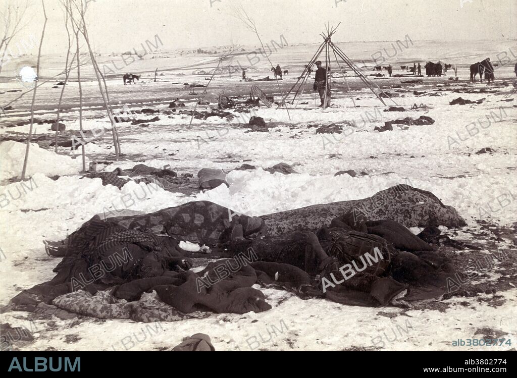 Big Foot's (Spotted Elk) camp three weeks after the Wounded Knee Massacre, with bodies of several Lakota Sioux people wrapped in blankets in the foreground and U.S. soldiers in the background, photographed by Trager and Kuhn, January 17, 1891. On the morning of December 29, 1890, the troops went into the camp to disarm the Lakota. One version of events claims that during the process of disarming the Lakota, a deaf tribesman named Black Coyote was reluctant to give up his rifle, claiming he had paid a lot for it. A scuffle over Black Coyote's rifle escalated and a shot was fired which resulted in the 7th Cavalry's opening fire indiscriminately from all sides, killing men, women, and children, as well as some of their own fellow soldiers. The Lakota warriors who still had weapons began shooting back at the attacking soldiers, who quickly suppressed the Lakota fire. The surviving Lakota fled, but U.S. cavalrymen pursued and killed many who were unarmed. By the time it was over, at least 150 men, women, and children of the Lakota had been killed and 51 were wounded. At least twenty soldiers were awarded the Medal of Honor. In 2001, the National Congress of American Indians passed two resolutions condemning the awards and called on the U.S. government to rescind them. The site of the battlefield has been designated a National Historic Landmark.