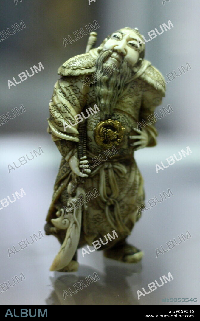 Japanese okimono representing legendary Chinese general Kanyu. Made from Ivory. Kanyu lived between 160-219 AD and was a general during the Three Kingdoms period in Chinese history. Stories of Kanyu (AKA Gaun Yu) are told in the 14th century novel 'Romance of the Three Kingdoms'. Was instrumental in helping Liu Bei to become the first emperor of the Kingdom of Shu. The artefact is highly detailed, and shows the artist had a great degree of skill.