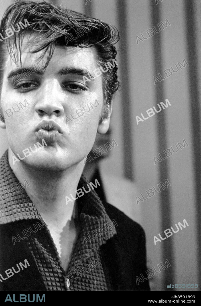 A vintage 1977 photograph featuring the King, Elvis Presley puckering his lips as he kisses the lens in this fantastic shot. This rare photo is a second generation example made after Elvis died in the 70s but was made off of the original negative. A standout photo of Presley that we have never seen before.