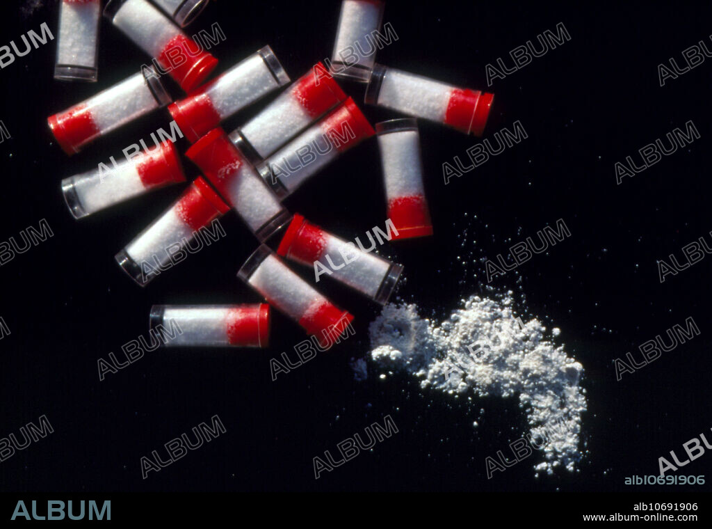Crack cocaine. Vials containing 'Crack', a potent, highly addictive derivative of cocaine. Crack is ingested by inhaling the vapour produced when the white crystals are heated. Cocaine is obtained from the leaves of the Erythroxylon coca plant. Cocaine was once used as a local anaesthetic, but due to its potential for abuse, it has been replaced with other anaesthetics. Cocaine interferes with the action of neurotransmitters in the brain, producing feelings of euphoria & increased energy. Regular abuse of this drug damages the nasal linings and leads to dependence. Psychosis may develop if high doses are taken. Overdose with crack or cocaine can cause seizures and cardiac arrest.