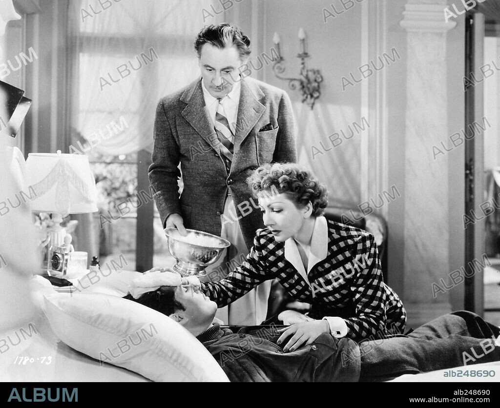 CLAUDETTE COLBERT, DON AMECHE and JOHN BARRYMORE in MIDNIGHT, 1939, directed by MITCHELL LEISEN. Copyright PARAMOUNT PICTURES.