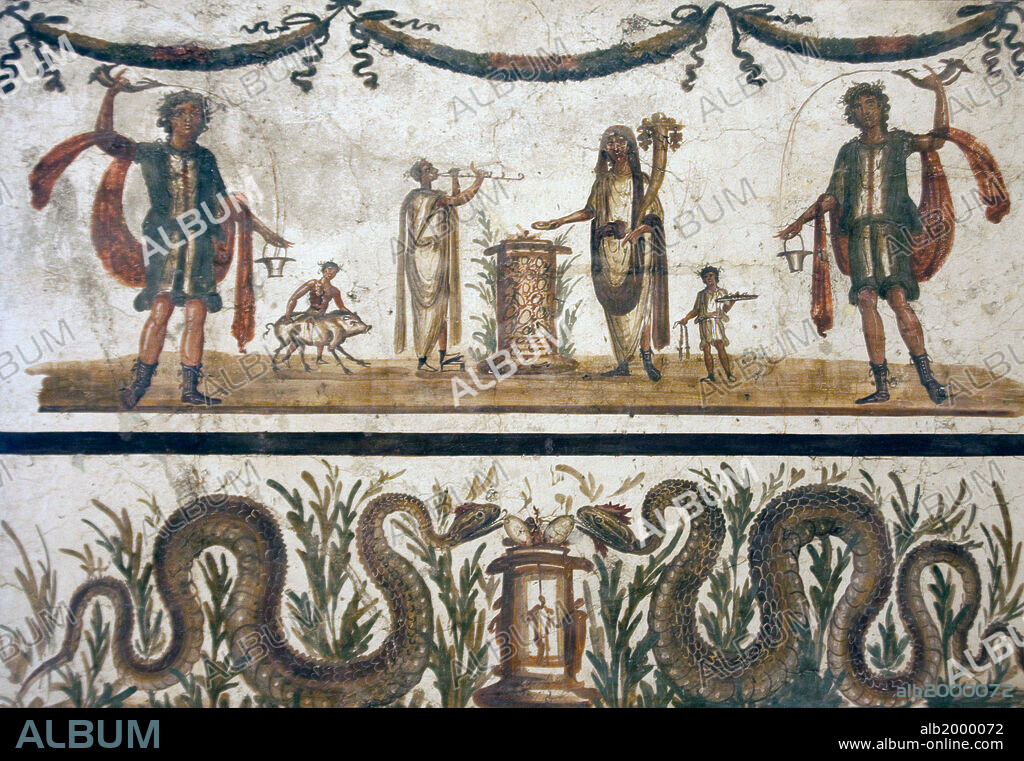 Italy, Naples, Naples National Archeological Museum, from a Lararium in Pompeii, Lares and Genius. In the lower part are two snakes crawling towards a cista mystica (sacred chest, or basket, used to house snakes).