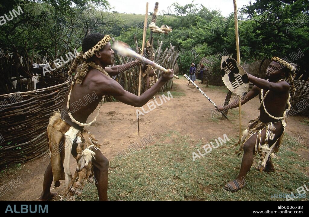 Zulu men demonstrating traditional fighting with sticks, Stock