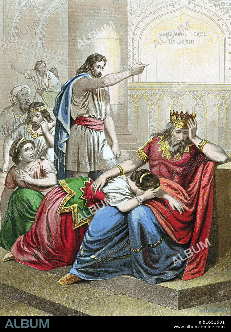 Daniel, one of the four great Hebrew prophets, interpreting the writing on the wall at Belshazzar king of Babylon's feast, 'Mene Mene Tekel Upharsin' (You are weighed in the scales and found wanting) and foretelling the king's and his kingdom's downfall. That night Belshazzar was killed. Bible Daniel 5:25 Chromolithograph c1860.