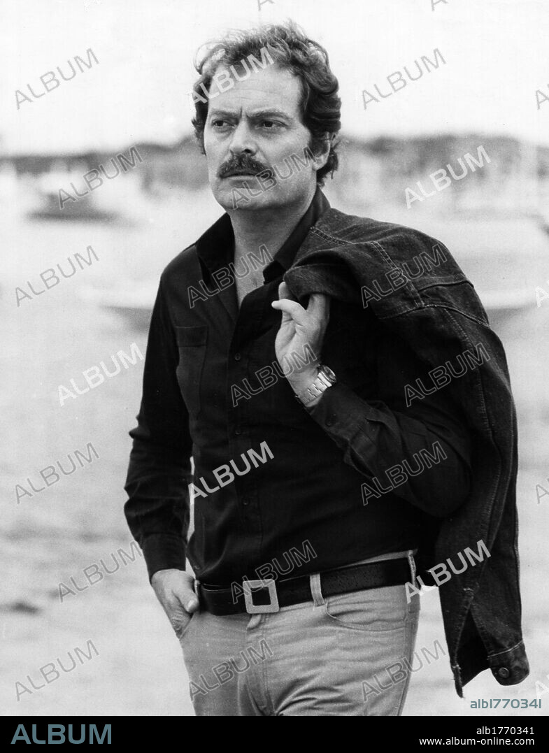 Sergio Fantoni walking on the shoreline. Italian actor Sergio Fantoni walking on the shoreline 1970's.
