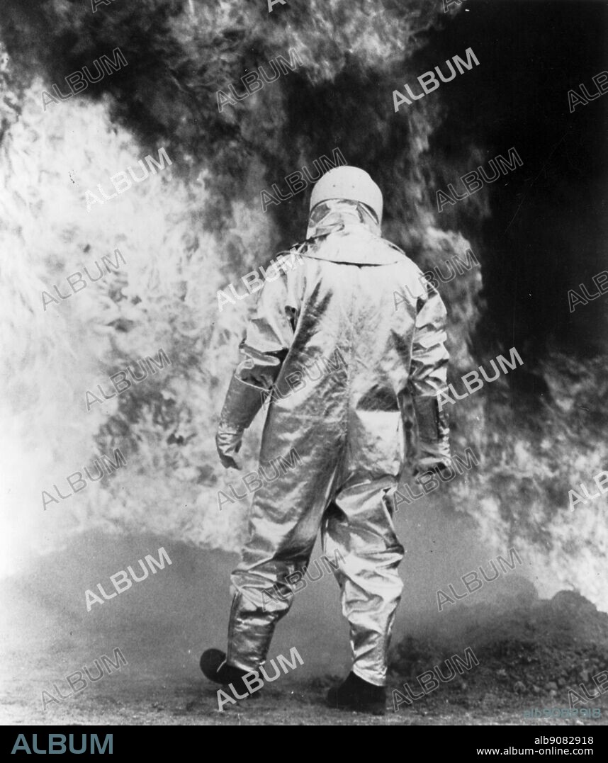 Asbestos. Man made fibres. approaching the fire in an asbestos suit.