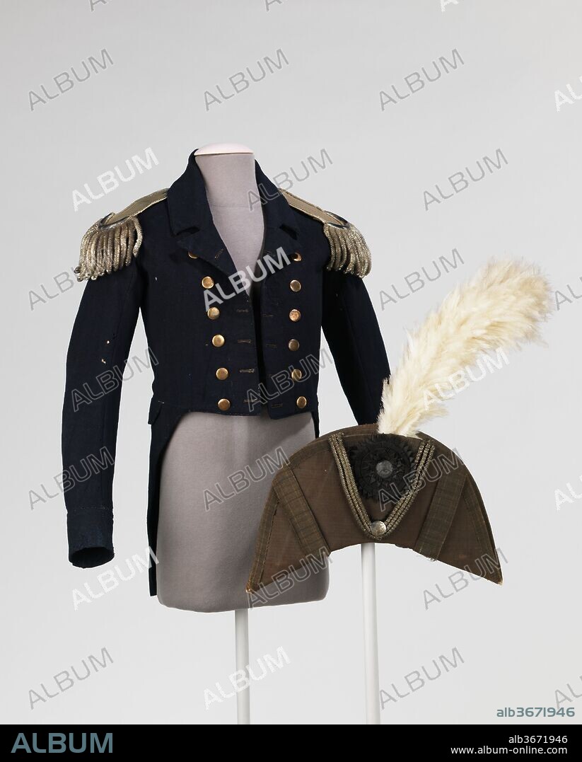 Military ensemble. Culture: American. Date: 1776-83.
According to the donor, this ensemble was worn by Obedeak [sic] Herbert, a Continental Naval Admiral of the Revolutionary War. This form of jacket, the tail coat, persisted first, as men's everyday wear and, later, as formal attire throughout the 19th and 20th centuries. The epaulettes retain sense of delicacy and refinement as handmade objects. The silk on the underside is padded and sewn into a roll at the edge to enhance the shape of the tassels as they fall over the shoulders. The tape on the other end is meant to tie into corresponding studs on the shoulders of the jacket.  The phrase on the medallion of the bicorne,  "E Pluribus Unum" (translated as "Out of Many, One") was submitted by the committee Congress as part of a design for the seal for the United States of America in 1776, which, upon revisions, was passed as the official seal in 1782. The phrase was considered the motto of the United States until 1956 when it was replaced with the motto, "In God We Trust.".