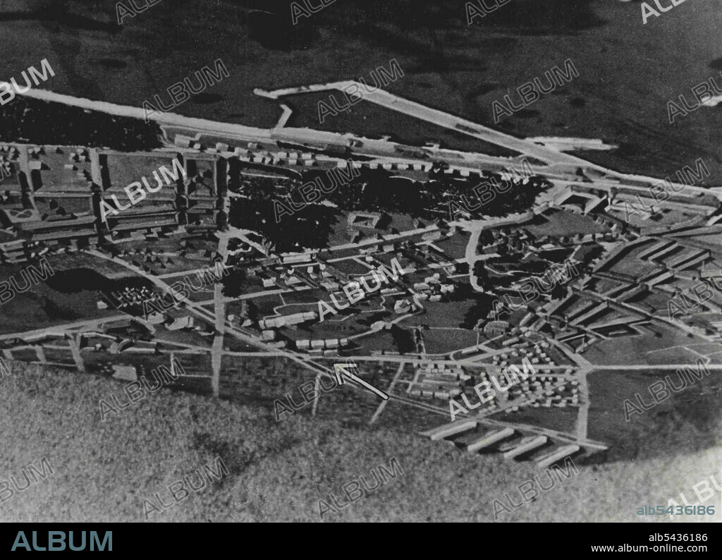 Mosquito Attack On Gestapo H.Q. At Aarhus. The model that was made for the briefing of the crews. The arrow points to the two buildings where the Gestapo was housed. On Tuesday 31.10.44. Mosquito of a Group of R.A.F. Second Tactical Air Force attacked the Gestapo H.Q. housed in the University of Aarhus, Denmark. Two adjoining 4 storey buildings formed the target. To obtain accuracy in bombing a model of the target was built for the crews. The aircraft went in to the attack at zero feet one pilot.