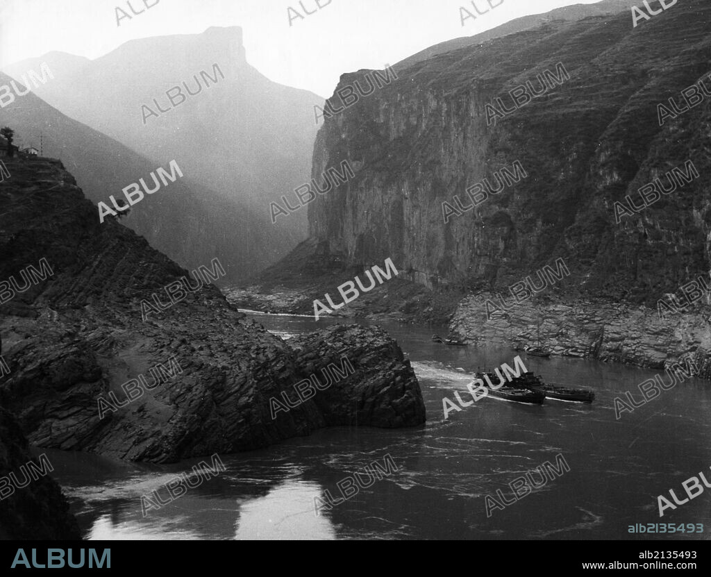 Two cargo ships in chu-tang gorge, one of the three gorges of the yangtze river, szechuan province, china, 1950s. 01/02/2013