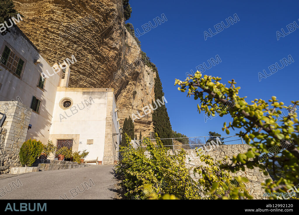 Sanctuary of Gracia and rocky cliffs, Puig de Cura mountain, Randa, Algaida, Mallorca, Balearic Islands, Spain.