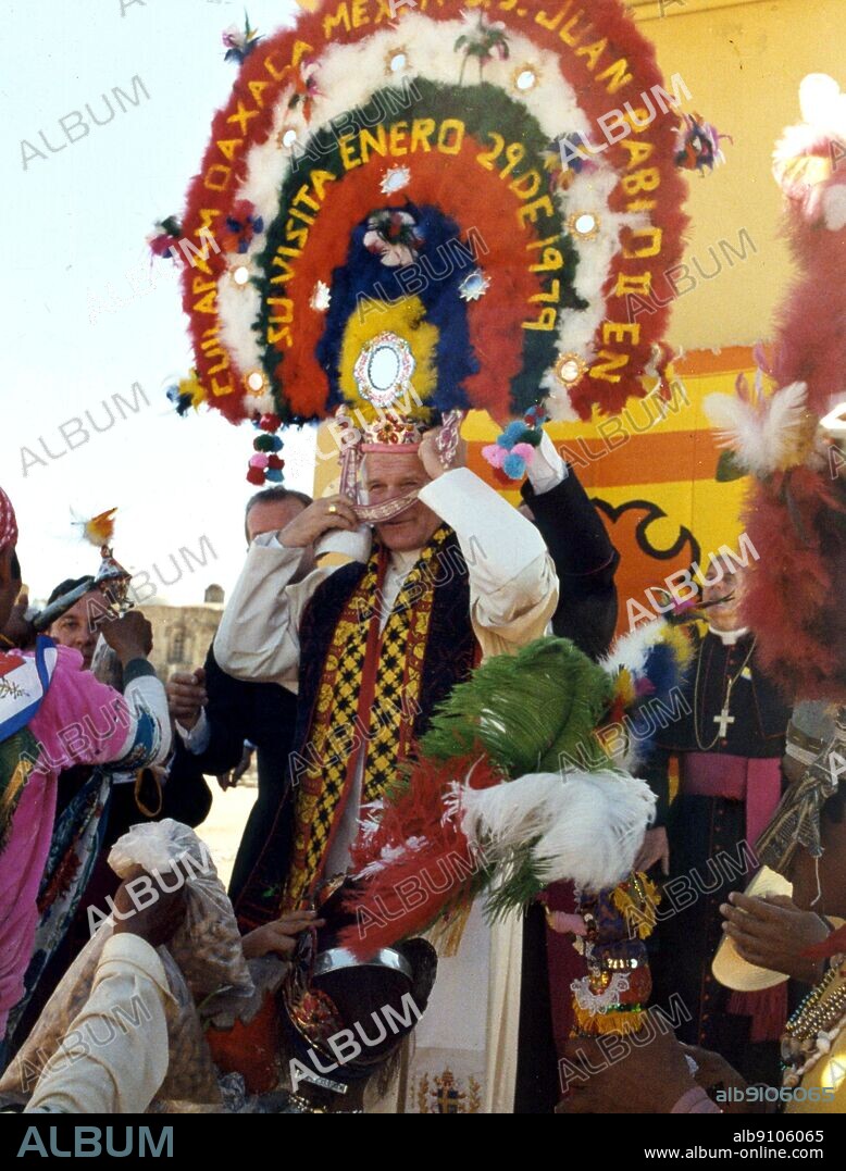 Pope John Paul II wearing an elaborate feather headdress on his visit to Mexico in 1979.