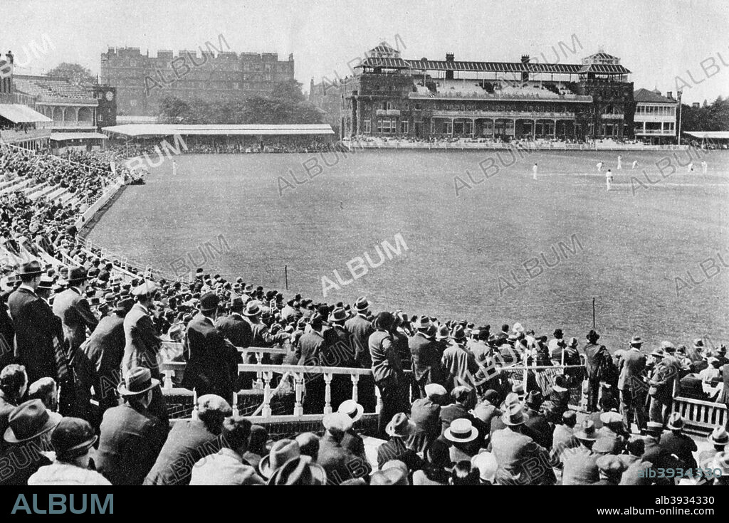Cricket at Lord's Cricket Ground, London, 1926-1927. Looking towards the pavilion from the Mound Stand. From Wonderful London, volume II, edited by Arthur St John Adcock, published by Amalgamated Press (London, 1926-1927).