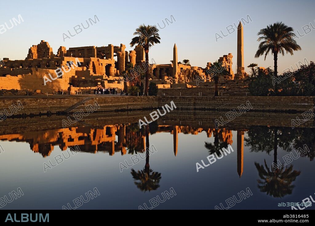 The Precinct of Amun-Re, part of the Karnak Temple Complex, at sunrise. Karnak was the residence of gods, Amun-Re, his wife Mut, and their son Khonsu, the moon god. The complex lies 4 kilometers to the north of modern day Luxor, or ancient Thebes. Built in the 12th dynasty, 2000 B.C.- 220 B.C.