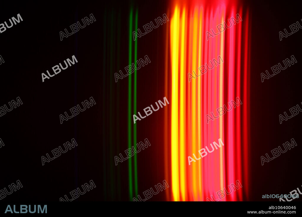 The spectra of krypton gas as observed through a diffraction grating. Each colour band corresponds to a specific energy of photon released by electrons jumping to different energy levels.