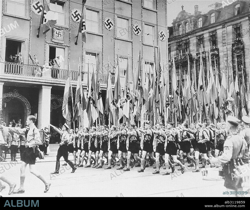Photograph of Hitler Youth members marching in celebration of Adolf Hitler's Birthday. Dated 1941.