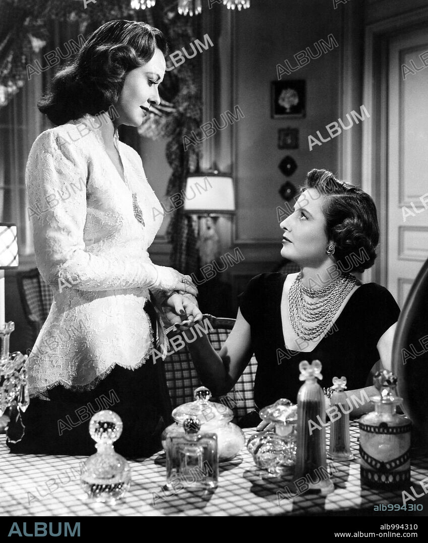 BARBARA STANWYCK and MARGARET LINDSAY in B. F. 'S DAUGHTER, 1948, directed by ROBERT Z. LEONARD. Copyright M.G.M.