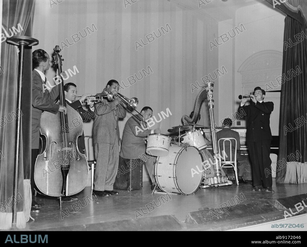 WILLIAM PAUL GOTTLIEB. Portrait of Tommy Potter, Max Kaminsky, Benny Morton, Zutty Singleton, Adele Girard, Teddy Wilson, and Joe Marsala, National Press Club, Washington, D.C., ca. 1939.