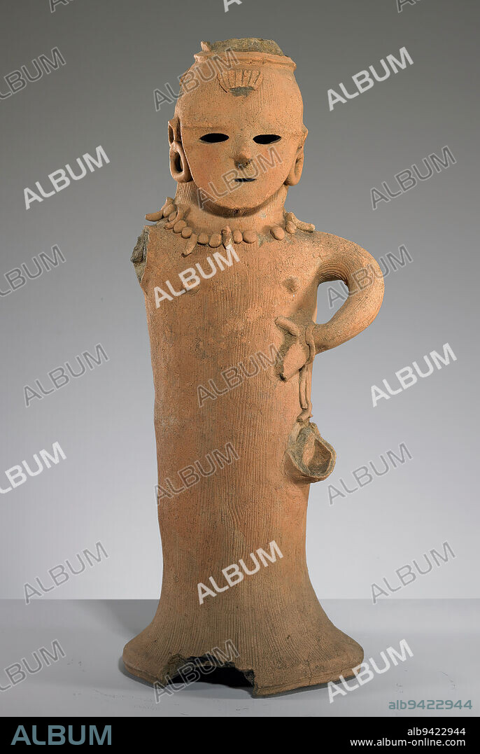 Haniwa of a Female Shrine Attendant, 6th century, Unknown Japanese, 22 3/8 x 9 3/4 x 8 1/2 in. (56.83 x 24.77 x 21.59 cm), Earthenware, Japan, 6th century, This haniwa, or clay funerary figurine, represents a female figure. Her necklace of magatama (claw- or fang-shaped jewels of special protective power) tells us that she is a miko, or shrine attendant, a respected position in early Japanese society. Traces of red pigment on her cheeks indicate tattoos or ceremonial face paint. In her original state she most likely wore a wide, flat hairdo that extended over her forehead. Her right arm, although now broken, once held a cup, an indication that she was responsible for preparing medicinal or magical potions.
