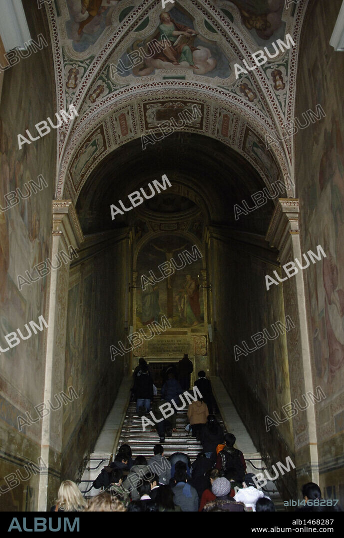 Pilgrims going up for the Holy Stairs kneeling. Rome. Italy.