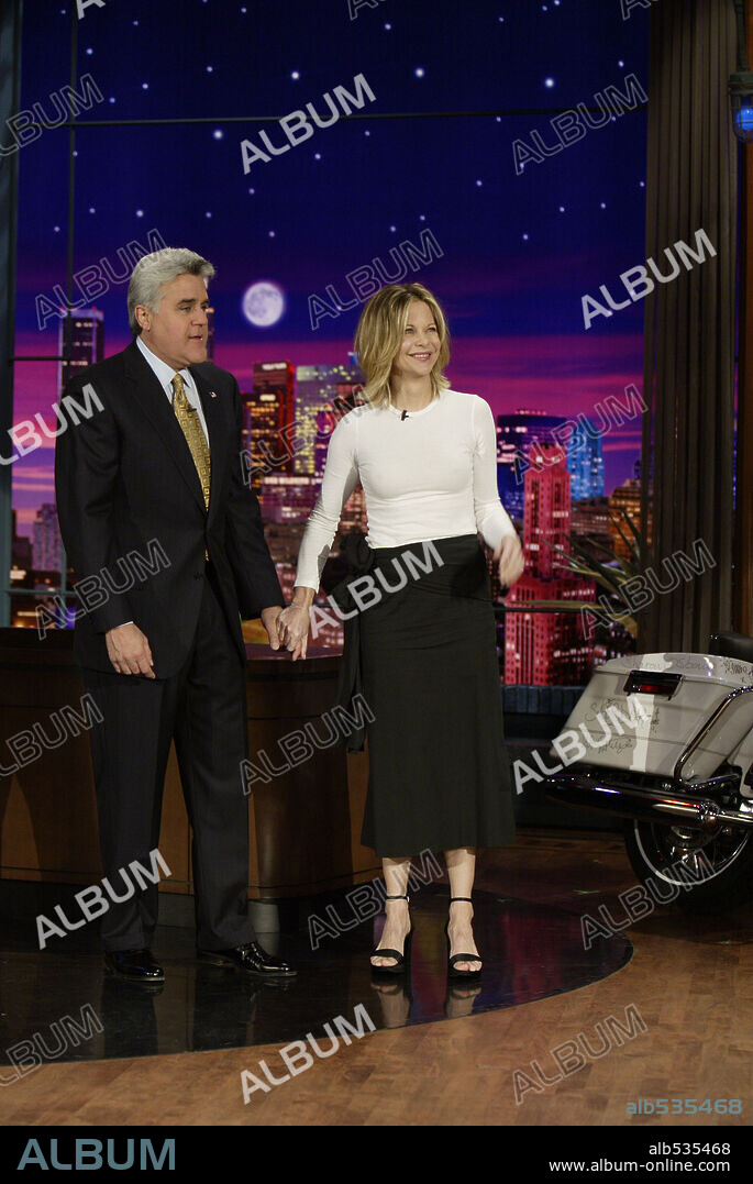 Feb 01, 2005; Hollywood, CA, USA; (l-r) JAY LENO and MEG RYAN who makes a special appearance to add her name to the Road King Motorcycle in efforts to raise money for the Red Cross International Disaster Relief Efforts to benefit victims of the tsunami disaster in South Asia on the 'Tonight Show With Jay Leno. 'Mandatory Credit: Photo by Paul Drinkwater / NBC Universal / Entertainment Pictures. (©) Copyright 2005 by Courtesy of NBC. 01/02/2005