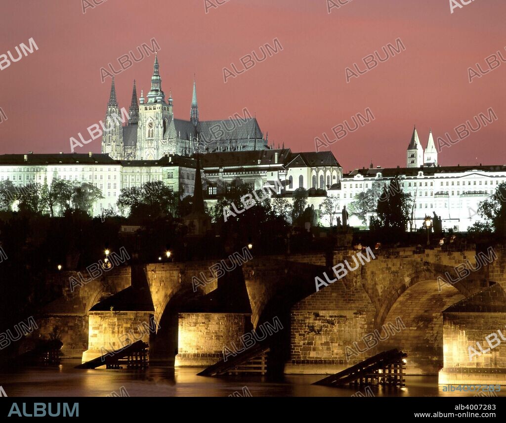Prague Castle and St Vitus Cathedral, Czech Republic. Built within the walls of Prague Castle, St Vitus Cathedral is the largest Gothic cathedral in central Europe. The piers of the 14th century Charles Bridge can be seen in the foreground.