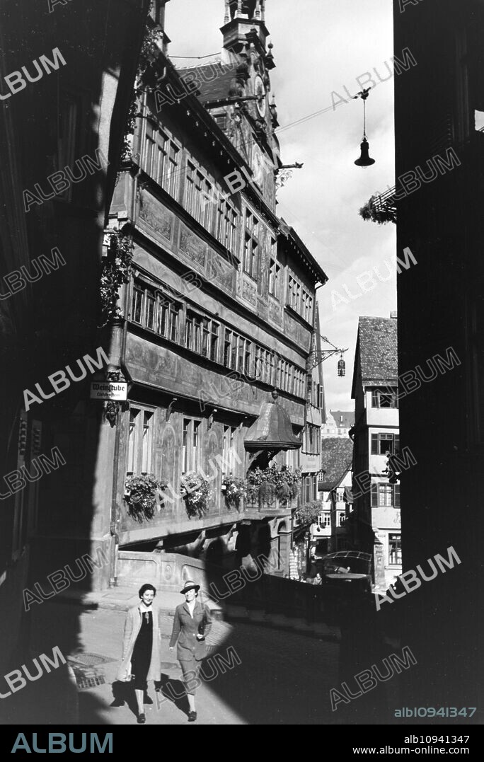 The balcony and astronomical clock of the townhall in Tuebingen, Germany 1930s.