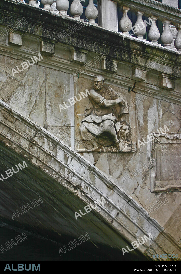 The Rialto Bridge (Italian: Ponte di Rialto) is one of the four bridges spanning the Grand Canal in Venice, Italy. It is the oldest bridge across the canal. The present stone bridge, a single span designed by Antonio da Ponte, was finally completed in 1591.