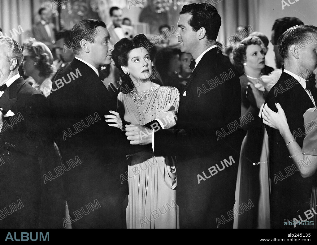 FRED MACMURRAY, HERBERT MARSHALL and ROSALIND RUSSELL in FLIGHT FOR FREEDOM, 1943, directed by LOTHAR MENDES. Copyright RKO RADIO.