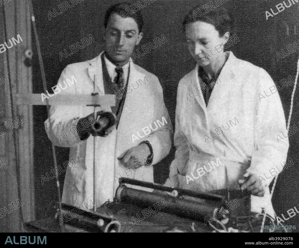 Frederic Joliot and Irene Joliot-Curie, French scientists, 1935. Joliot (1900-1958) became assistant to Marie Curie in 1925. In 1926 he married Marie's daughter Irene and in 1935 shared with her the Nobel prize for Chemistry for their work on the synthesis of new radioactive elements. A photograph from Album de Photographies, Dans L'Intimite de Personnages Illustres, 1855-1915, Editions MD, 22 Rue de L'Arcade, Paris 8, 1855-1915.
