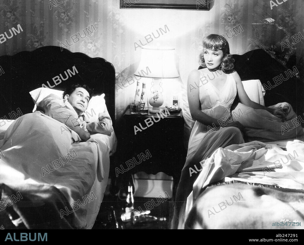 EDWARD G. ROBINSON and MARLENE DIETRICH in MANPOWER, 1941, directed by RAOUL WALSH. Copyright WARNER BROTHERS.