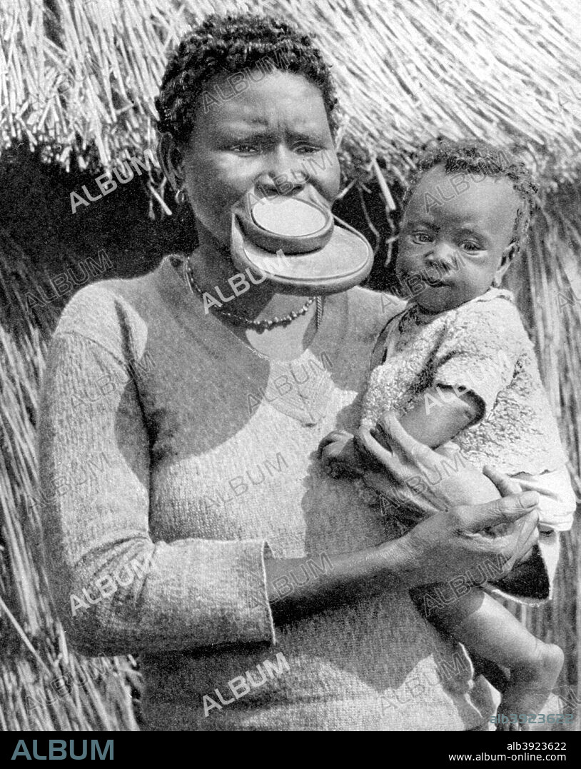 A woman from the Sara-Kaba tribe, Congo Republic, Africa, 1936. Her beauty has been ruined to prevent rivals. From Peoples of the World in Pictures, edited by Harold Wheeler, published by Odhams Press Ltd (London, 1936).