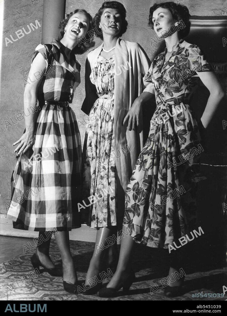 ***** Miss NSW, ***** Pat Woodley, talks over with models Hazel Rogers (left) preparations for a mannequin parade she will compere at the Trocadero between 12.30 and 2.30 tomorrow. October 30, 1951.