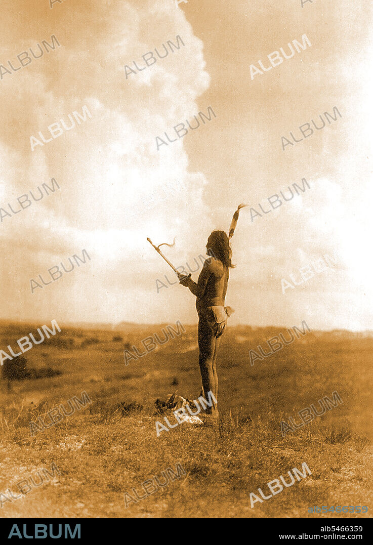 Edward S. Curits Native American Indians - Teton Sioux Indian performing vision cry ceremony through fasting and chanting to the Great Mystery circa 1907.