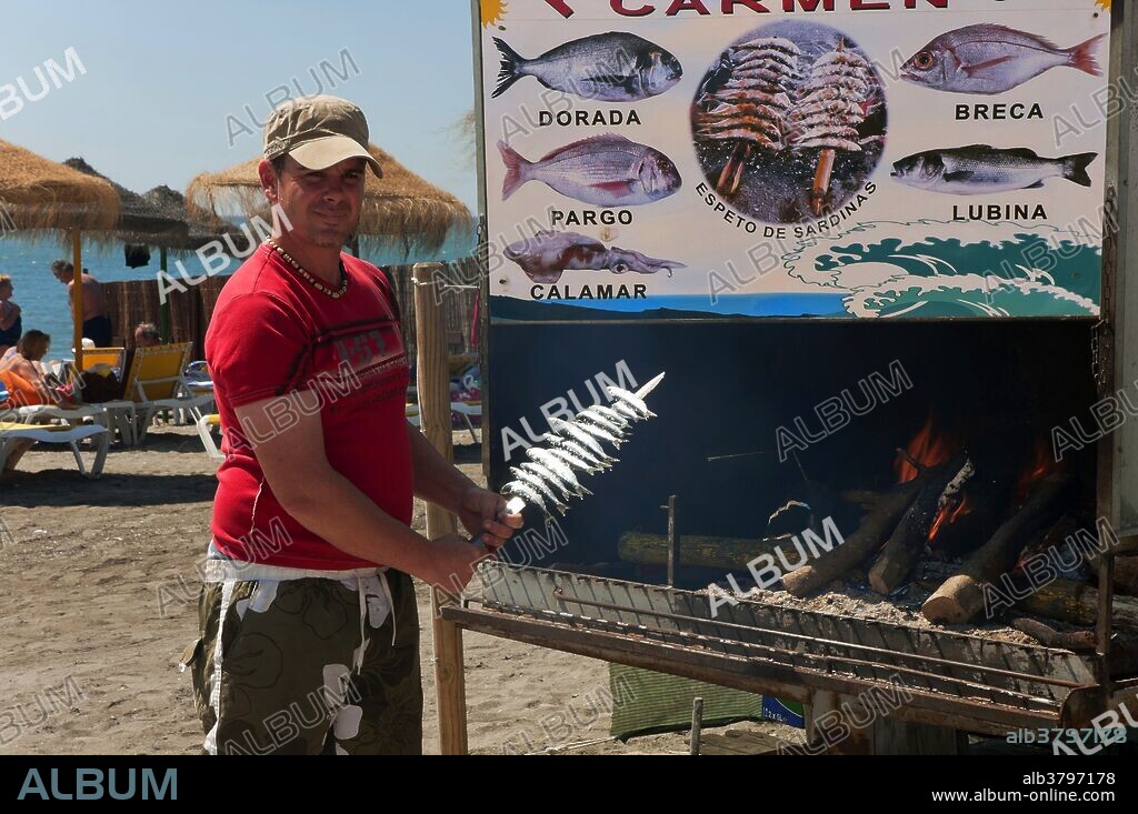 Skewers or Espeto of sardines, Torre del Mar beach, Malaga province, Region of Andalusia, Spain, Europe.