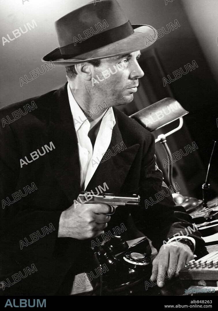 DICK POWELL in MURDER, MY SWEET, 1944, directed by EDWARD DMYTRYK. Copyright RKO RADIO PICTURES / Cortesía.