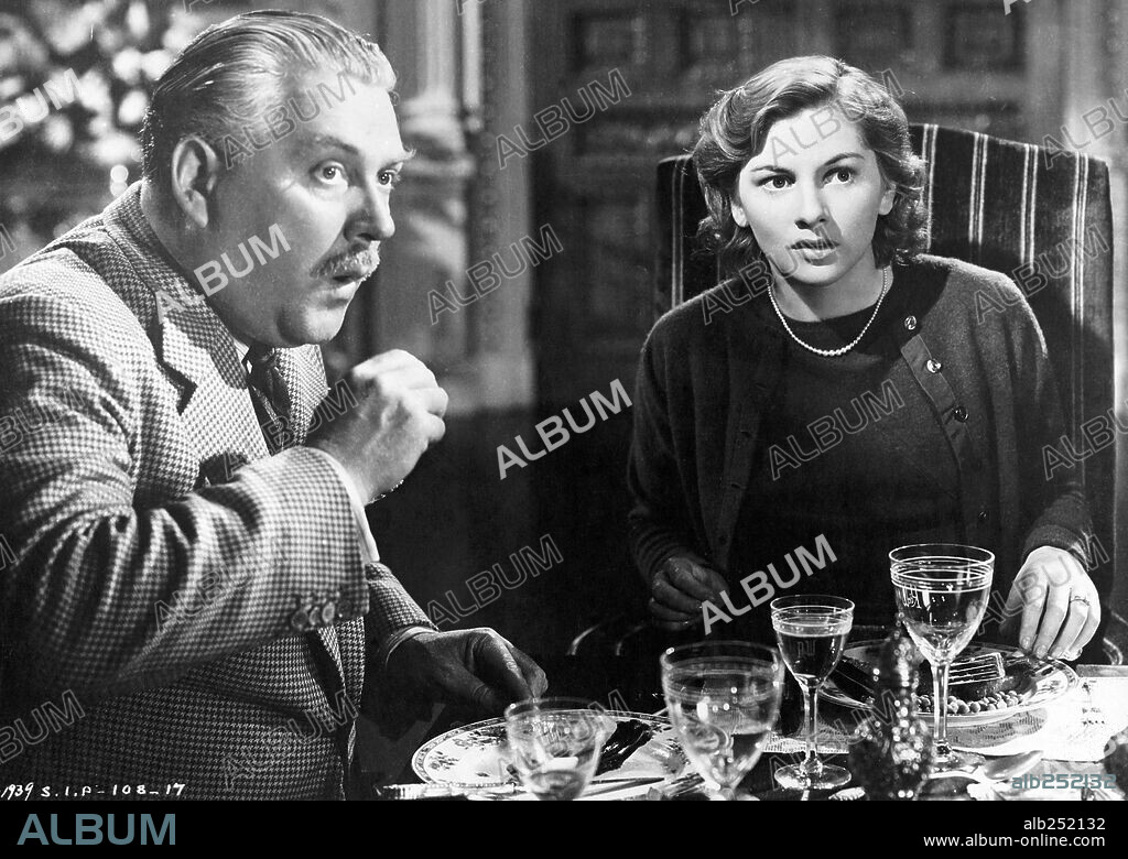 JOAN FONTAINE and NIGEL BRUCE in REBECCA, 1940, directed by ALFRED HITCHCOCK. Copyright Selznick International Pictures.