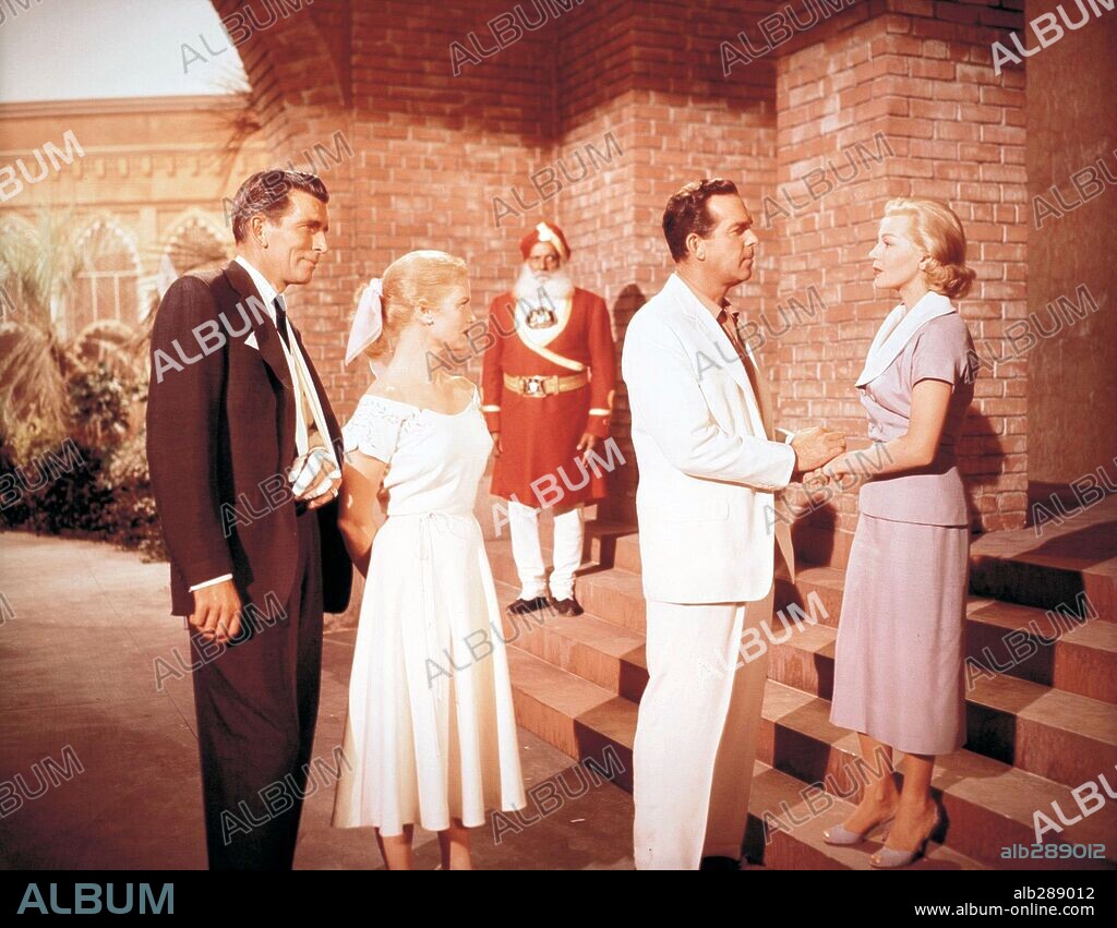 FRED MACMURRAY, JOAN CAULFIELD, LANA TURNER and MICHAEL RENNIE in THE RAINS OF RANCHIPUR, 1955, directed by JEAN NEGULESCO. Copyright 20TH CENTURY FOX.