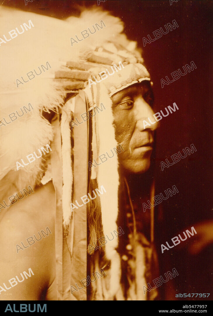 Edward S. Curtis Native American Indians - Pretty Paint, Crow man, head-and-shoulders portrait circa 1905.