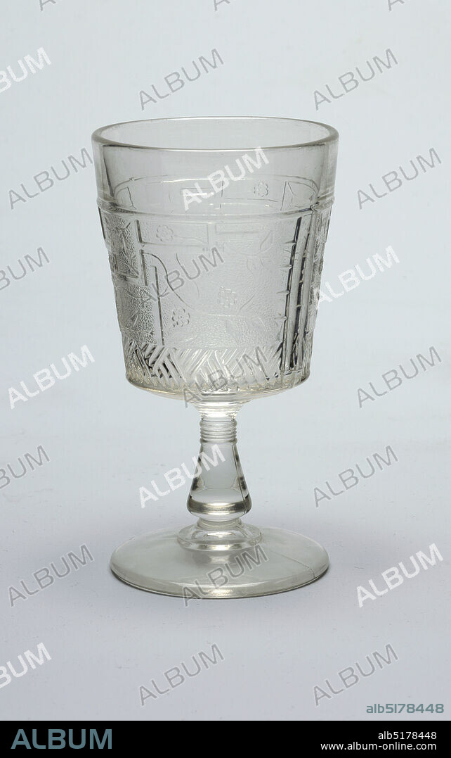 Goblet pressed glass Clear glass. Tapering cylindrical cup on flaring conical stem on stepped circular foot. Cup molded with Japanese inspired decoration of fret work f Album alb5178448