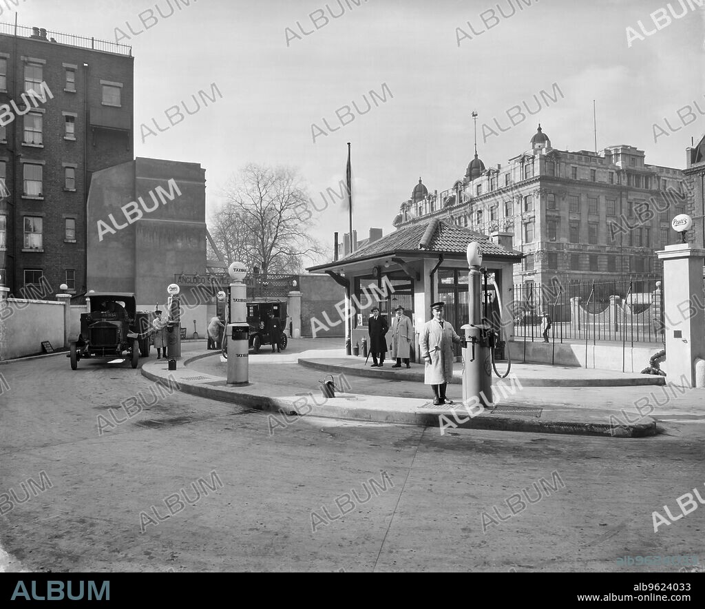 BEDFORD LEMERE AND COMPANY. Anglo-American Oil Company petrol station, Euston Road, London, 1922. The company was founded in 1888, importing lamp oil and later motor spirit from the US, including a range of grades. Some grades were sold under the  Pratt's brand. The company later went on to become Esso.
